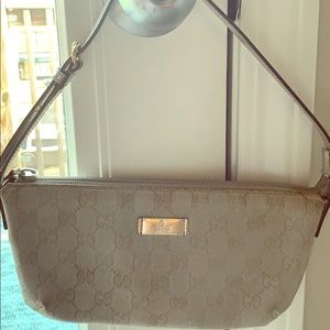 Authentic Gucci silver pochette with strap